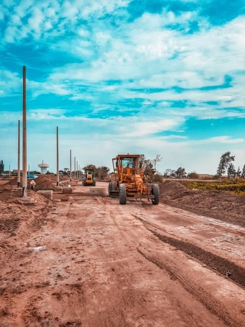 heavy machinery working on highway infrastructure project in Sonora desert