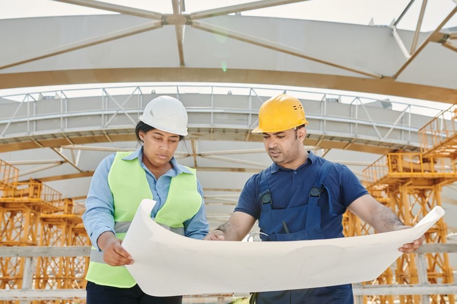 Mexican construction workers discussing plans