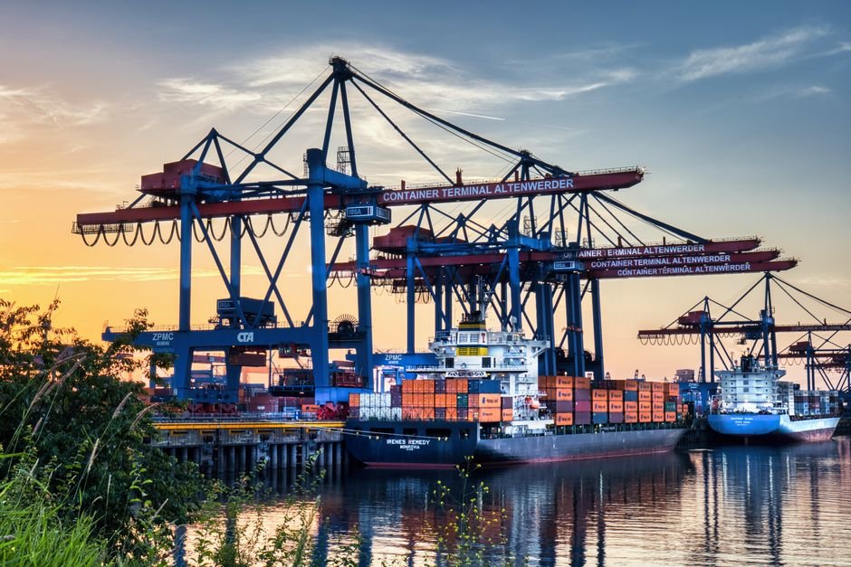 modern container port logistics infrastructure with cranes and cargo ships