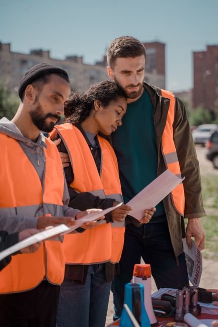 civil engineer reviewing blueprints on a road construction project