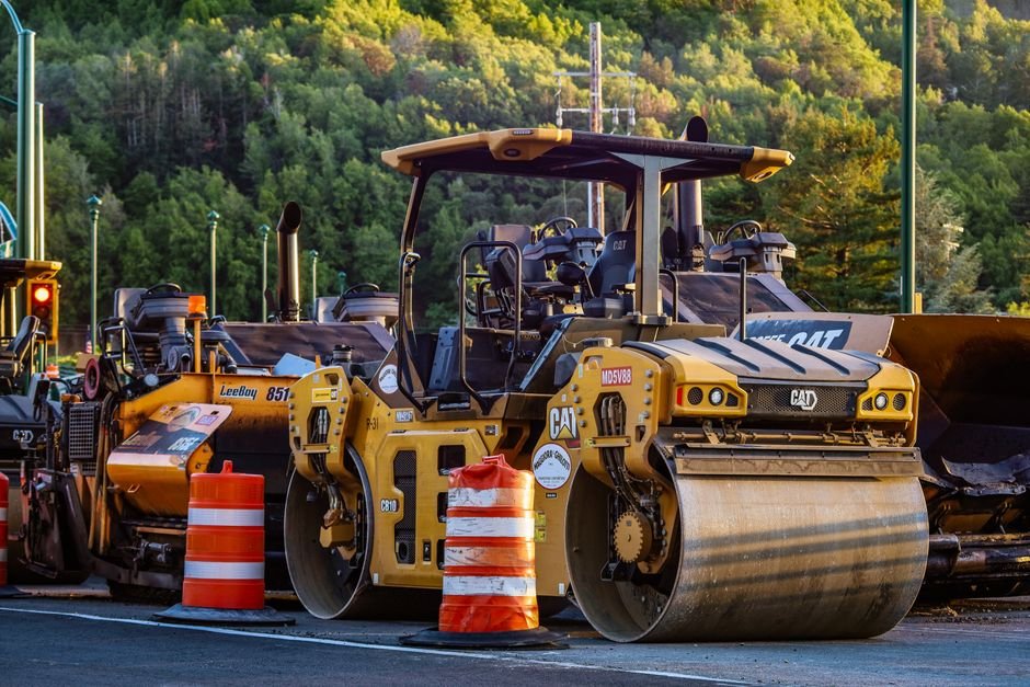 Heavy construction machinery working on industrial highway expansion in northern Mexico desert