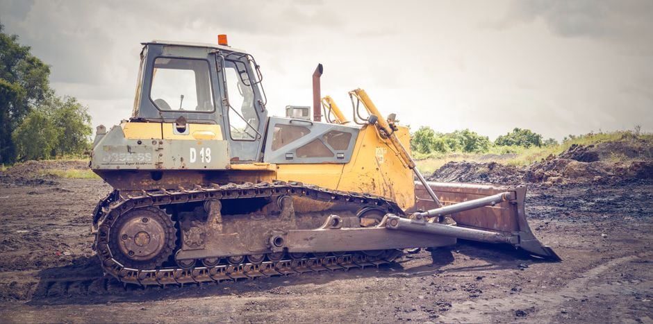 heavy machinery compacting soil on industrial construction site mexico
