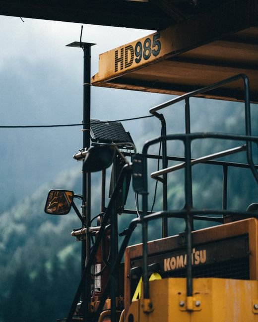 Heavy machinery working inside a newly excavated mountain tunnel
