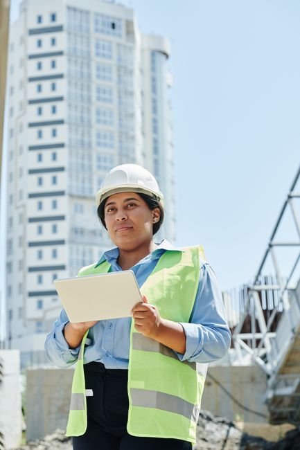 modern architectural construction site management with digital tablets