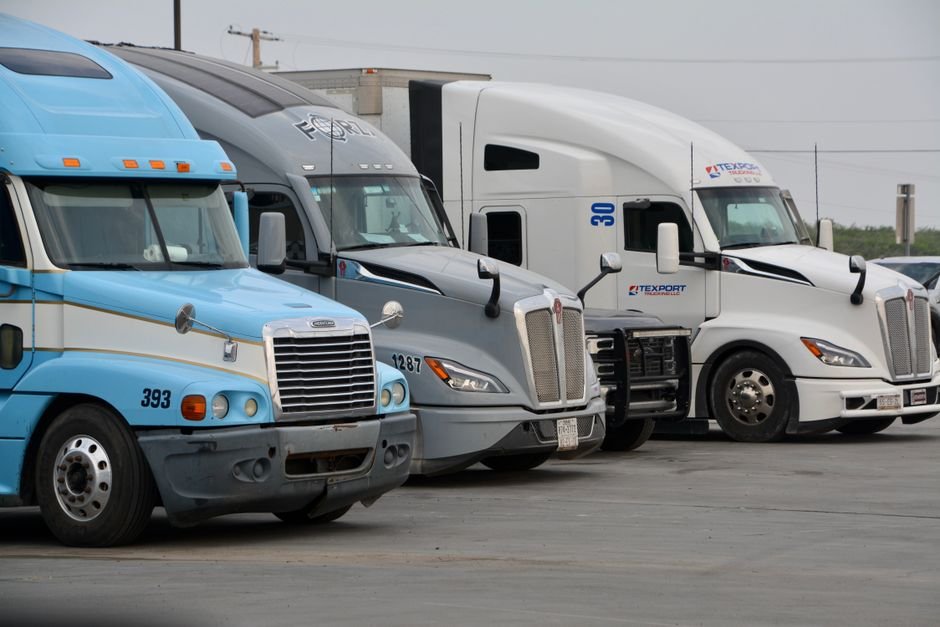 Modern commercial border crossing between Mexico and United States with industrial trucks