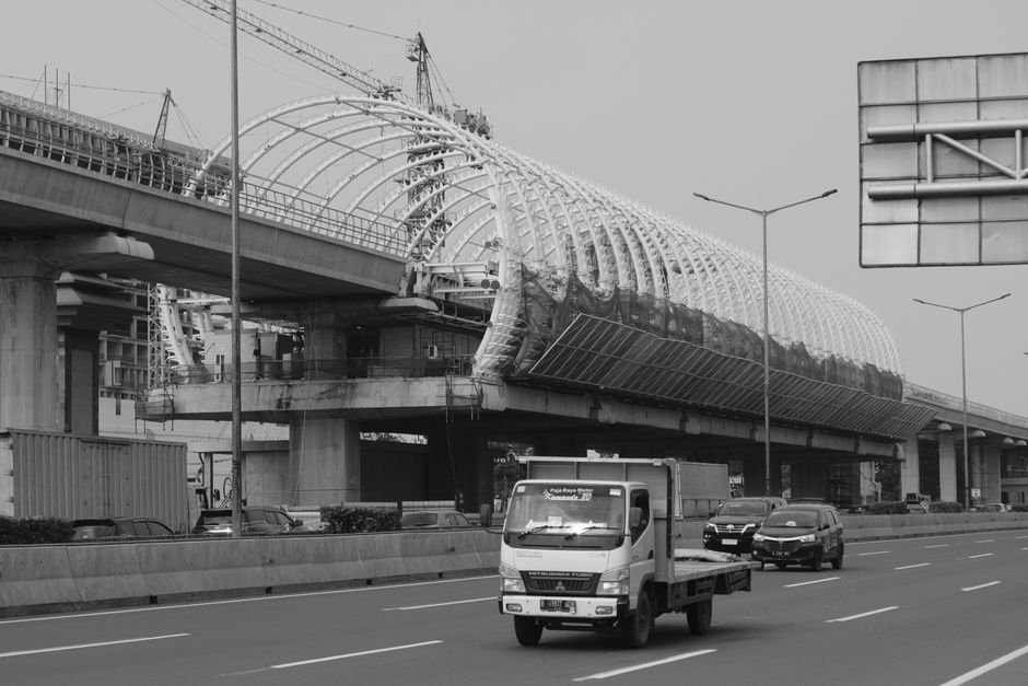 modern highway bridge with heavy traffic and industrial logistics