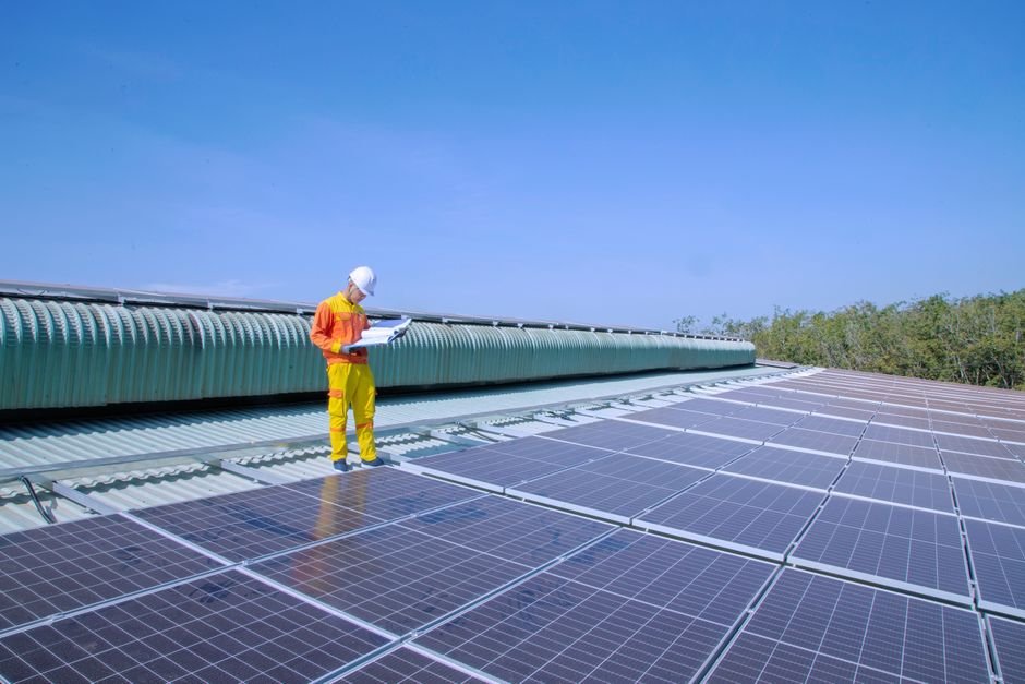 Modern solar panels installation in a desert construction site with engineers