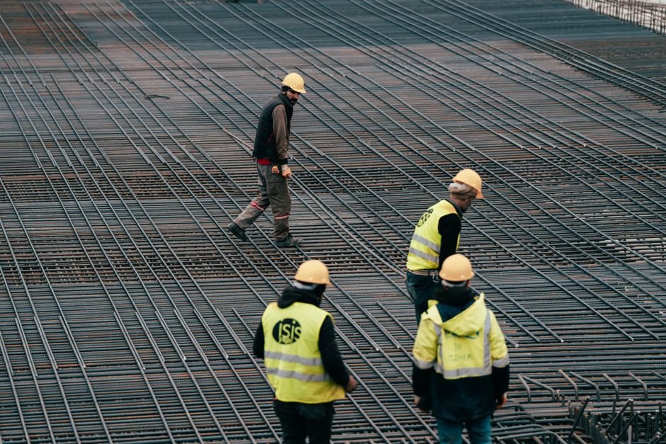 workers installing steel rebar for seismic resistant foundation