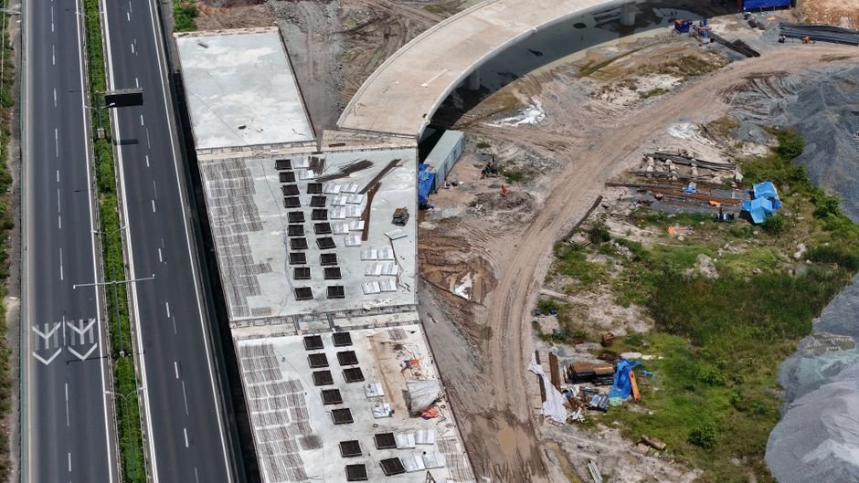 civil engineers inspecting bridge expansion joints and highway paving