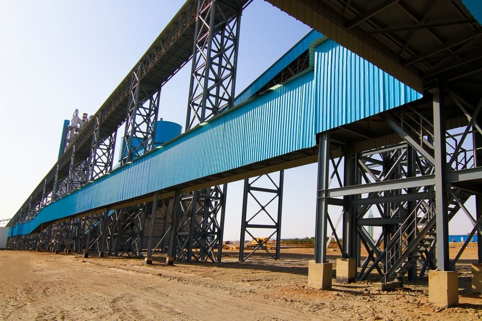 engineers reviewing blue prints on a large scale industrial construction project in Sonora