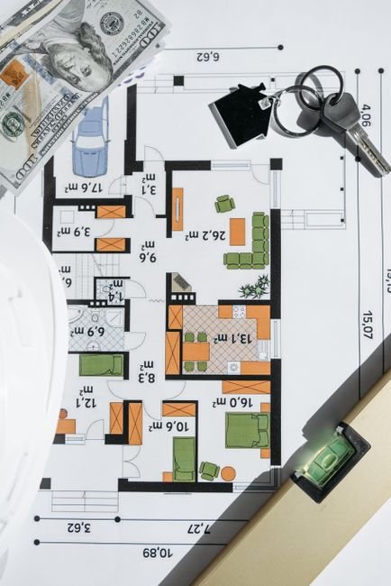 financial graphs and modern architectural blueprint construction