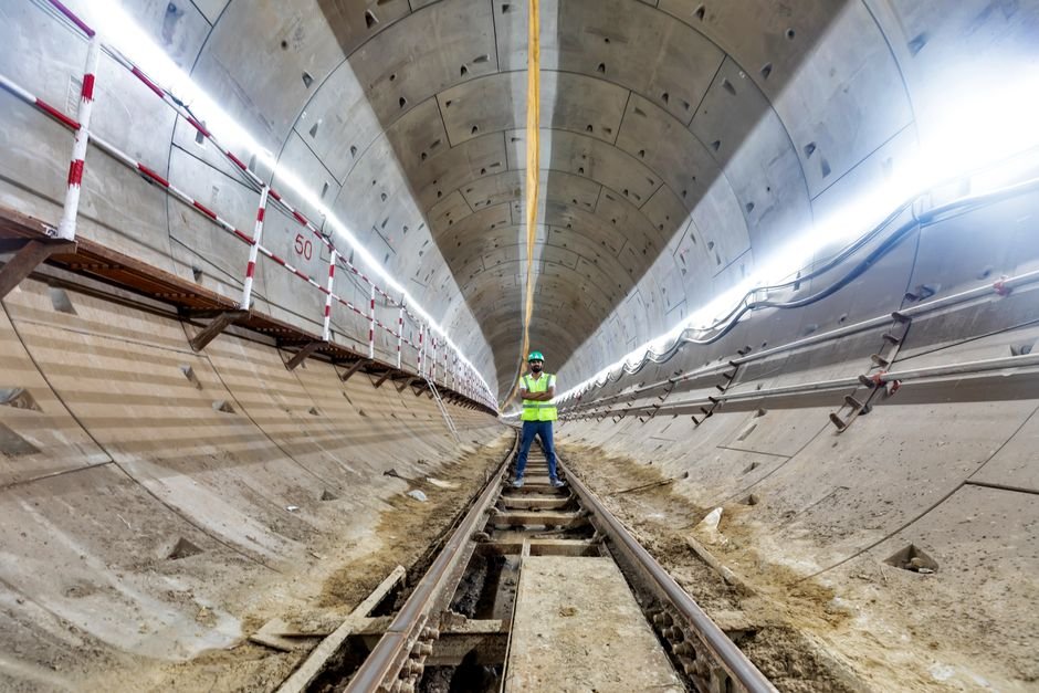 geotechnical engineer inspecting mine tunnel stability with laser scanner