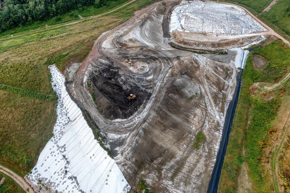 geotechnical engineers analyzing soil samples at mining construction site