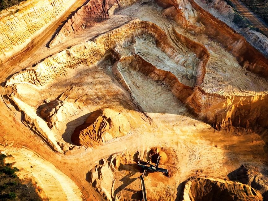 mining engineer analyzing geological rock samples at open pit site