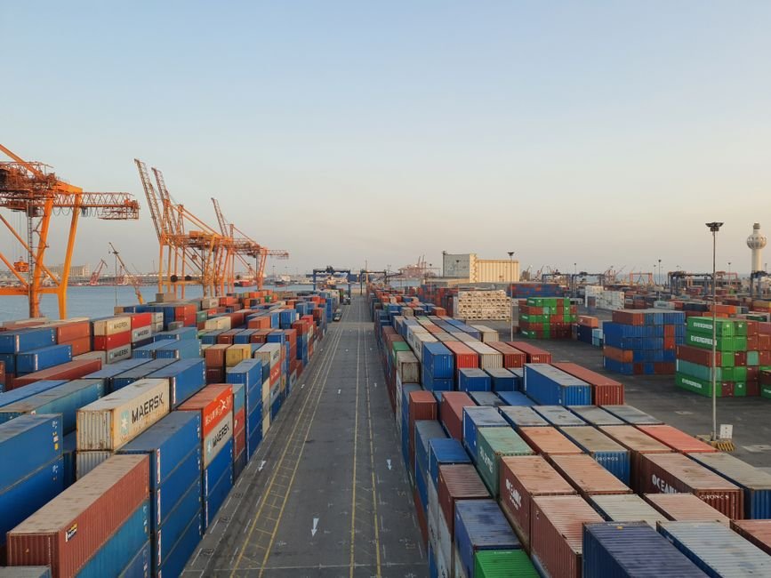 Modern port terminal with cargo cranes and industrial container yard