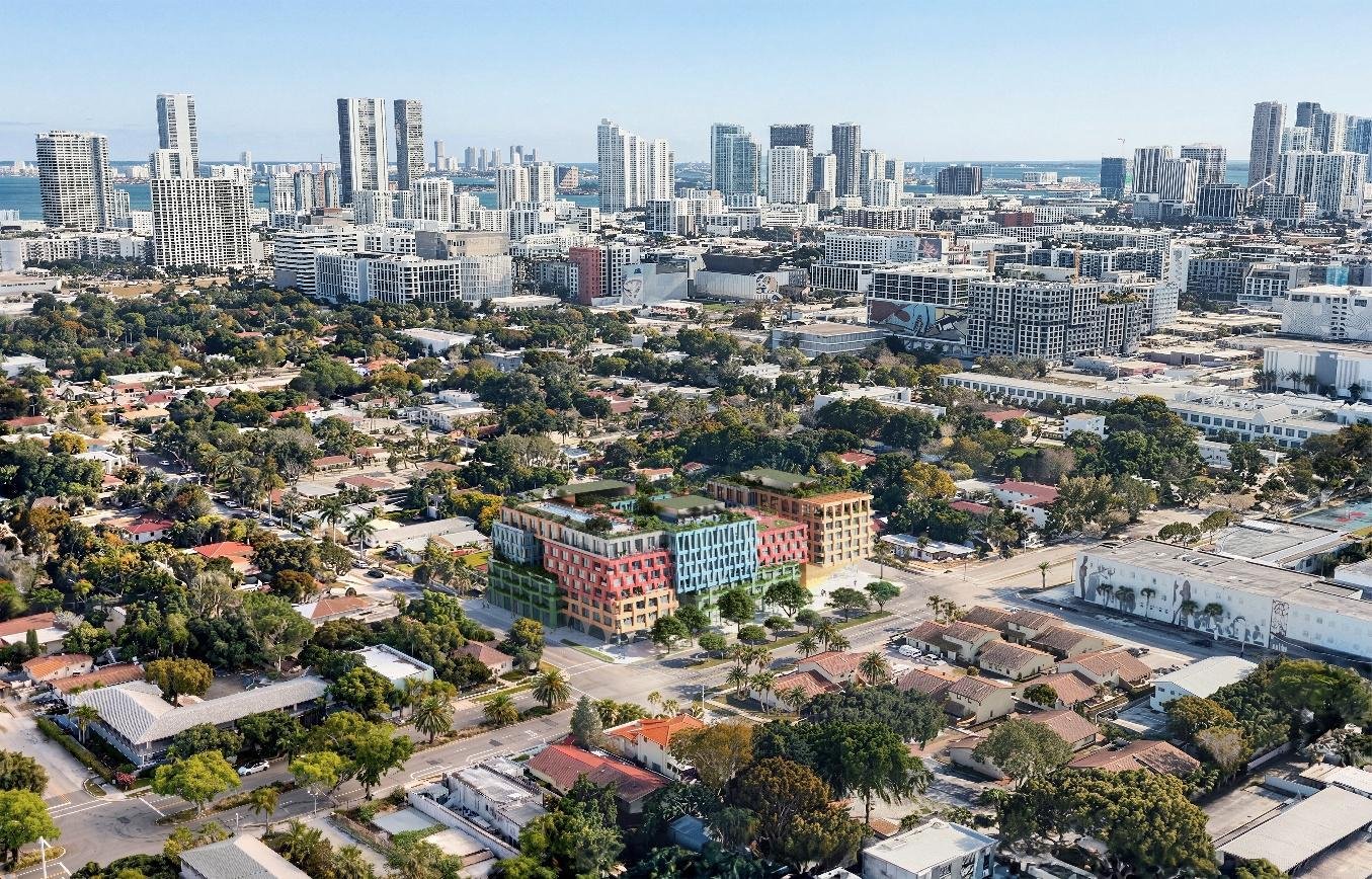 Render del edificio residencial WOMA en Wynwood Norte, Miami, con su fachada de tres frentes en azul, verde, naranja, rojo y plata