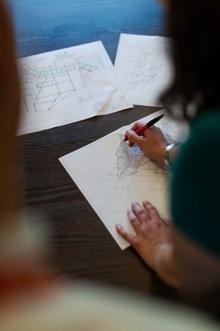 civil engineer working on structural bridge blueprint with tablet