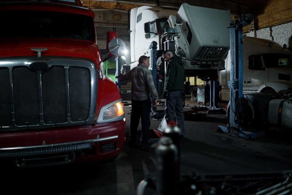 engineers inspecting modular building components on a truck
