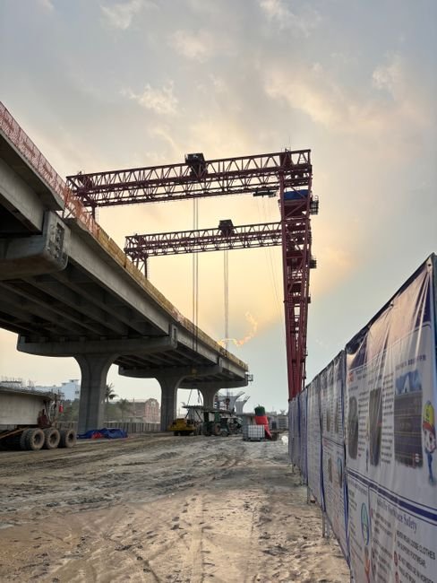 modern highway bridge construction project with heavy machinery